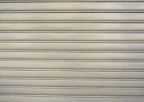 yellow aluminium rolling shutter metal texture useful as a background