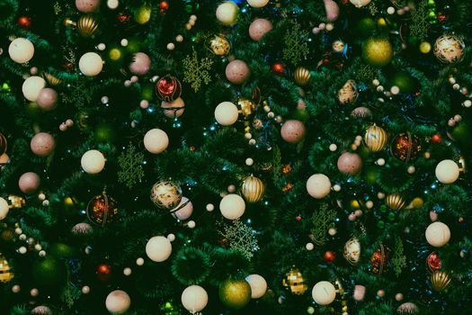 the annual Christian festival celebrating Christ's birth, held on December 25 in the Western Church. Background with New Year toys and branches of a christmas tree.