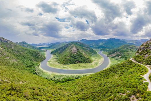 Canyon of Rijeka Crnojevica river near the Skadar lake coast. One of the most famous views of Montenegro. River makes a turn between the mountains and flows backward.