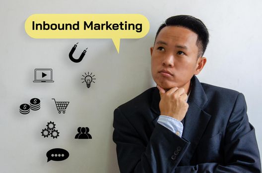 Businessman thinking Inbound marketing icon virtual screen investment analysis for future technology concepts.