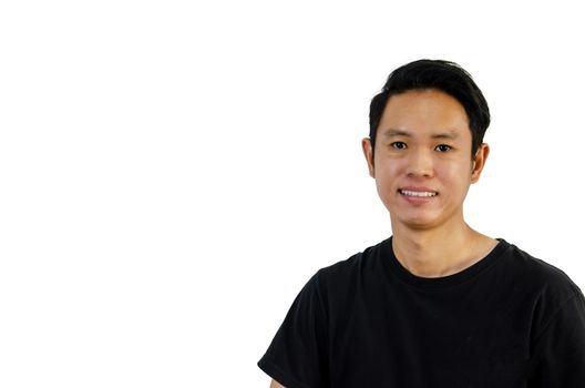 Asian man wearing black t-shirt smiling showing teeth on white background.