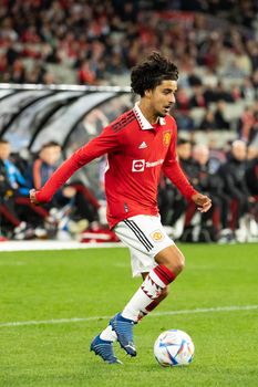 MELBOURNE, AUSTRALIA - JULY 15: Zidane Iqbal of Manchester United runs with the ball against Melbourne Victory in a pre-season friendly football match at the MCG on 15th July 2022