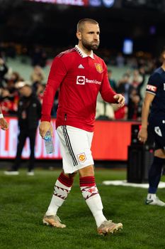 MELBOURNE, AUSTRALIA - JULY 15: Luke Shaw of Manchester United enters the field before Melbourne Victory plays Manchester United in a pre-season friendly football match at the MCG on 15th July 2022