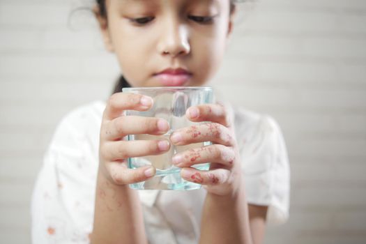 child girl drinking milk while sited . 6 year old