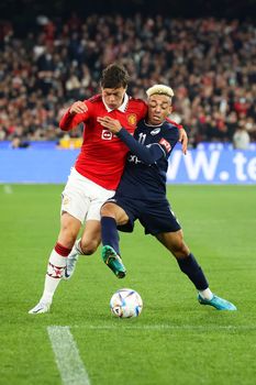 MELBOURNE, AUSTRALIA - JULY 15: Ben Folami of Melbourne Victory plays against Victor Lindelof of Manchester United in a pre-season friendly football match at the MCG on 15th July 2022