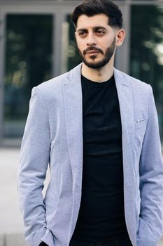 Vertical portrait of nice-looking caucasian multi-race bearded businessperson elegant young man. Career people. Fashion, beauty. Male portraits.