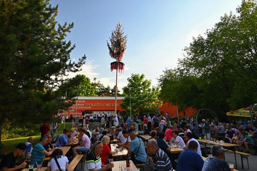 Brno - Bystrc, Czech Republic, June 25, 2022.  Traditional Czech feast. Folk Festival. Girls and boys dancing in beautiful costumes. An old Christian holiday, a day of abundance, joy and prosperity.