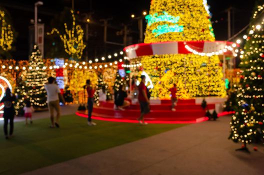 Blur Festival people Christmas abstract background. New year and Christmas party decorations with lights.