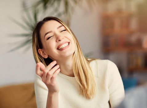 Portrait of a young happy girl talking with a friend