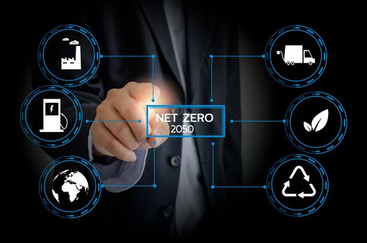 Businessman touching net zero save the eco world and reduce pollution virtual screen. virtual screen Business Technology Concept.