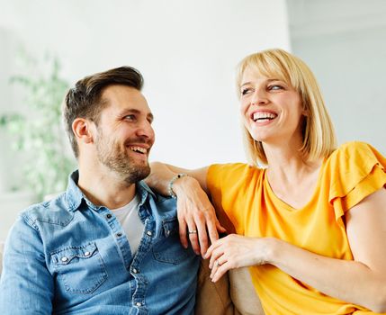 Portrait of a lovely young couple together at home