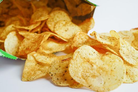 Potato chips in open bag, delicious BBQ seasoning spicy for crips, thin slice deep fried snack fast food in open bag.