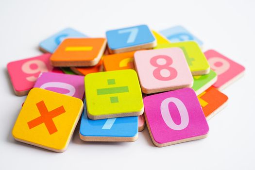 Number wood block cubes for learning Mathematic, education math concept.