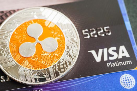 Bangkok, Thailand - December 15, 2021 Golden bitcoin with credit card on US dollar banknotes money for business and commercial, Digital currency, Virtual cryptocurrency.