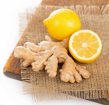 Ginger with mint and lemon on table