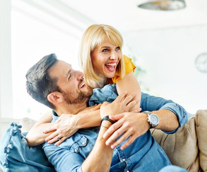 Portrait of a lovely young couple together at home