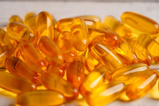 Fish oil or Cod liver oil gel in capsules with omega 3 vitamins, supplementary healthy food 