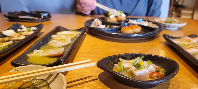 japanese food dish in an oriental restaurant with wooden table and light background