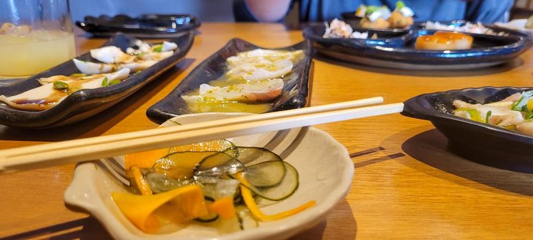 japanese food dish in an oriental restaurant with wooden table and light background