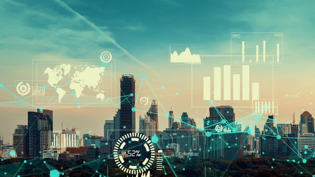 Business data analytic interface fly over smart city showing alteration future of business intelligence. Computer software and artificial intelligence are used to analyze big data for strategic plan .