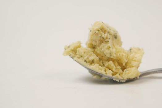 fresh garlic butter on a spoon on white background ,