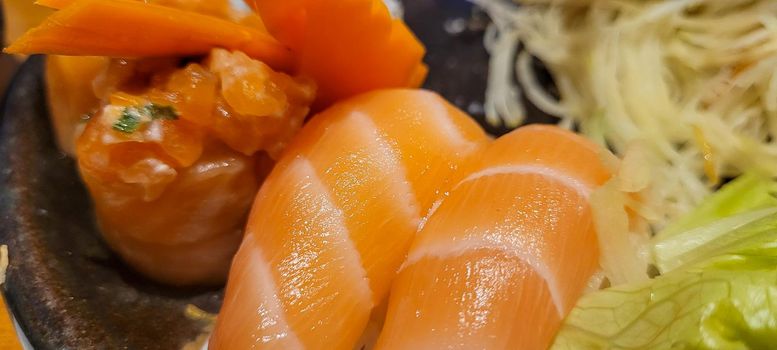 japanese food dish in an oriental restaurant with wooden table and light background