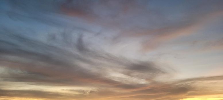 colorful late afternoon sunset in the countryside of Brazil inserting the day