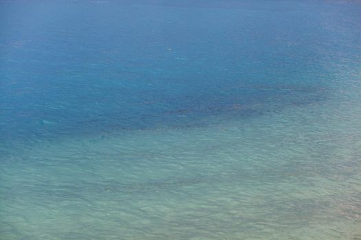 Seascape of clear water on the sea. Clear water on the ocean, sea or lake. Water ripples in the sun.