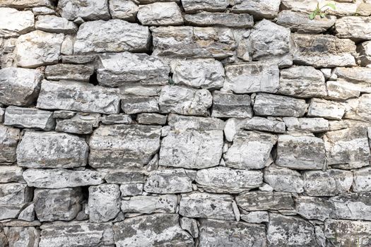 Walls made of stone. Old wall background.