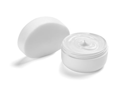 close up of a white beauty cream container and tube on white background