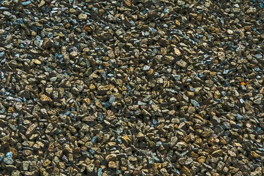 the area or scenery behind the main object of contemplation, especially when perceived as a framework for it. Brown blue gray background of small stones for decor and text