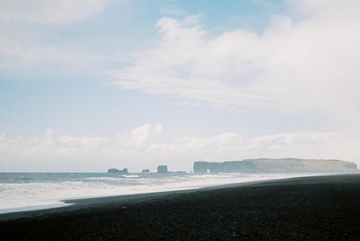 Black sand of Vik beach in Iceland. High quality photo