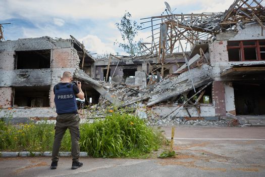 War correspondent photographs destroyed buildings after the bombing of the Chernihiv city in Ukraine. War in Ukraine.