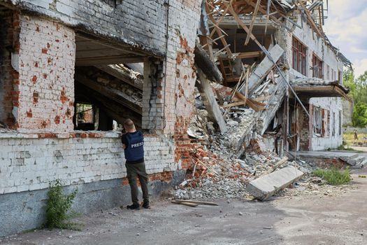 War correspondent photographs destroyed buildings after the bombing of the Chernihiv city in Ukraine. War in Ukraine.