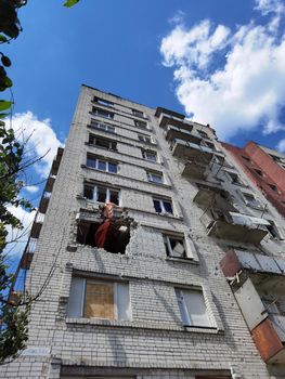 Chernihiv, Ukraine - June 27, 2022: War in Ukraine. Damaged ruined multi-storey house in ukrainian city Chernihiv near Kyiv on north of Ukraine. Ruins during War of Russia against Ukraine