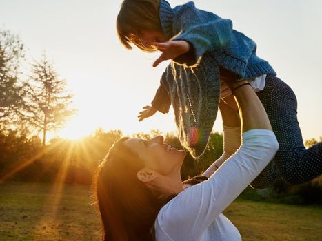 a mother and daughter enjoying some time outdoors together.