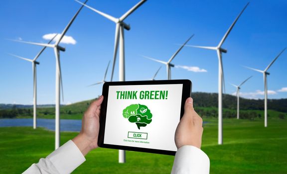 Green business transformation for environment saving and ESG business concept. Businessman using tablet to set corporate goal toward environmental friendly management and alternative clean energy use.