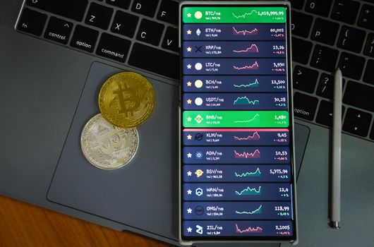 Mobile at on computer, launching program for trading cryptocurrency