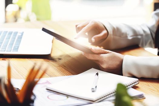 business woman using a tablet computer for data analysis, marketing, accounting.