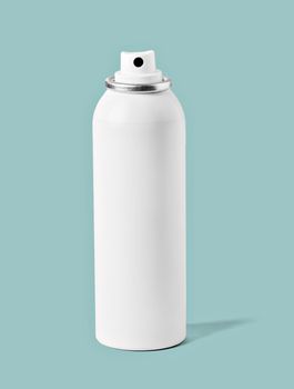 Close up of a spray aerosol bottle on white background