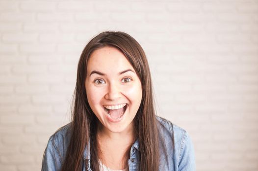 positive woman smiling on a light background. High quality photo