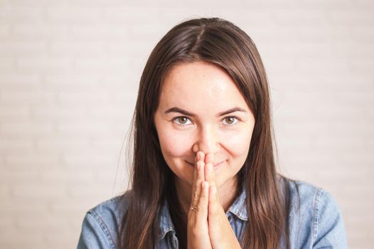 positive woman smiling on a light background. High quality photo