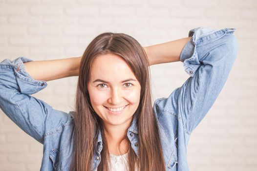 positive woman smiling on a light background. High quality photo