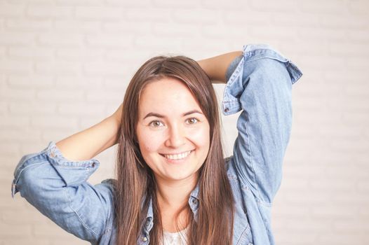 positive woman smiling on a light background. High quality photo