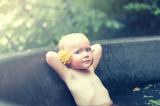 funny baby in the spa in hot tubs. High quality photo