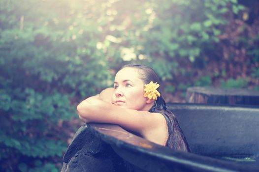 woman enjoying spa in hot tubs outdoors. High quality photo