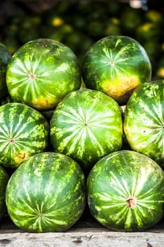 many sweet ripe watermelons on the market. High quality photo