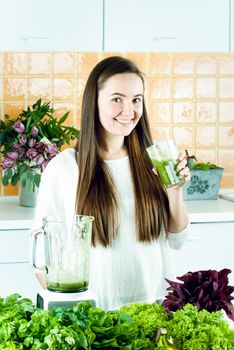 woman is going green healthy shake in blander for breakfast