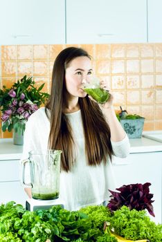 woman is going green healthy shake in blander for breakfast
