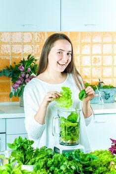 woman is going green healthy shake in blander for breakfast